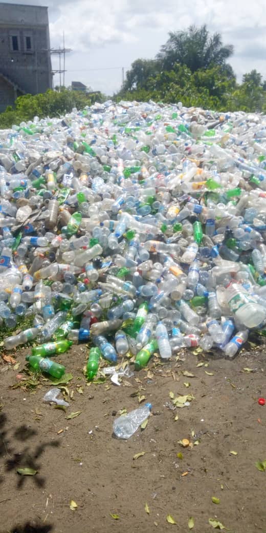 Large pile of post-consumer plastic bottles